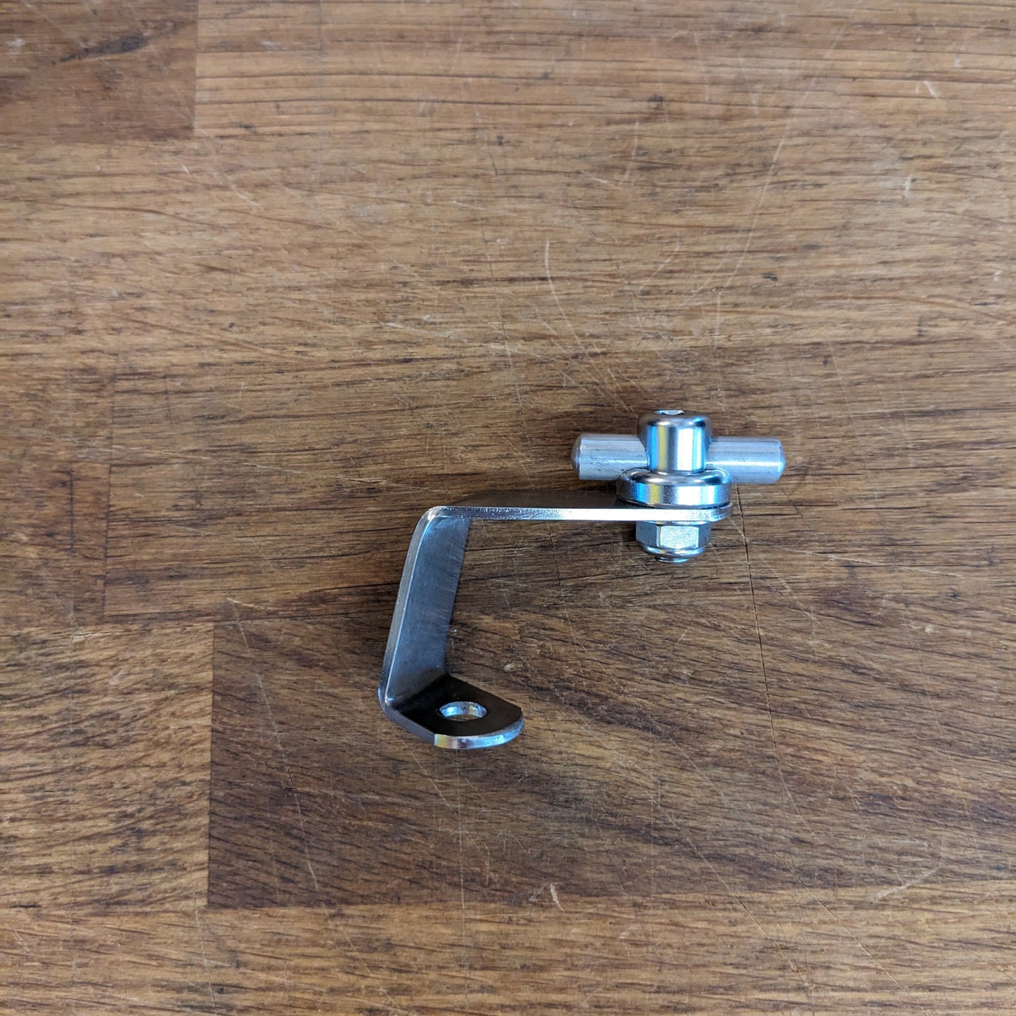 Metal lever on a wooden surface