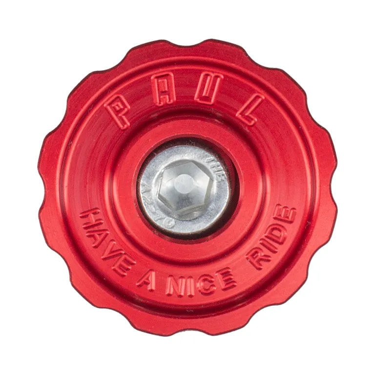 Red valve cap with 'PAUL' and 'HAVE A NICE RIDE' text on a white background