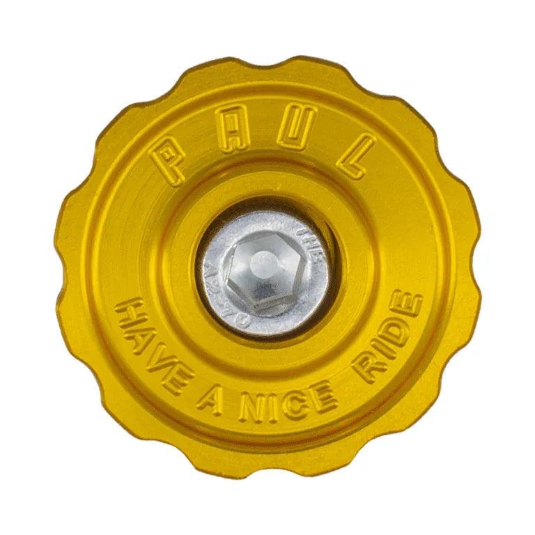Yellow valve cap with 'Have a Nice Ride' text on a white background