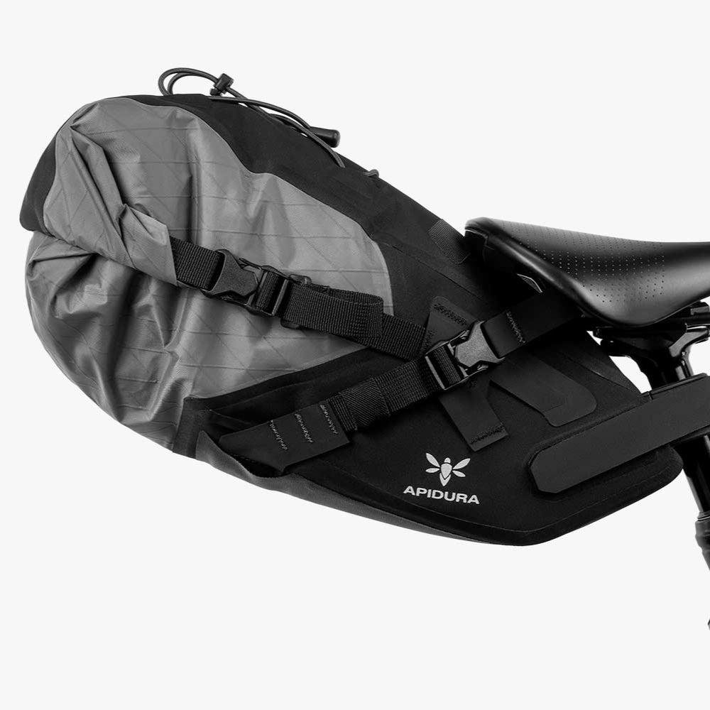 Bicycle saddle bag attached to a bike seat on a white background