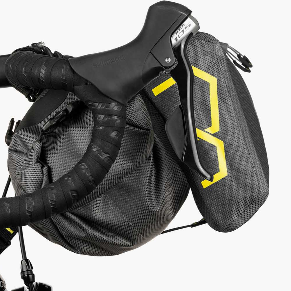 Bicycle with a black saddle bag featuring a yellow logo on a white background