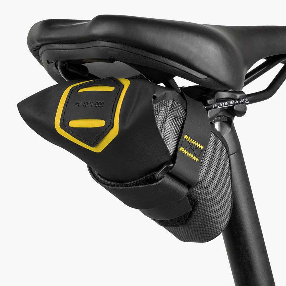Bicycle saddle with a black and yellow seat bag on a white background